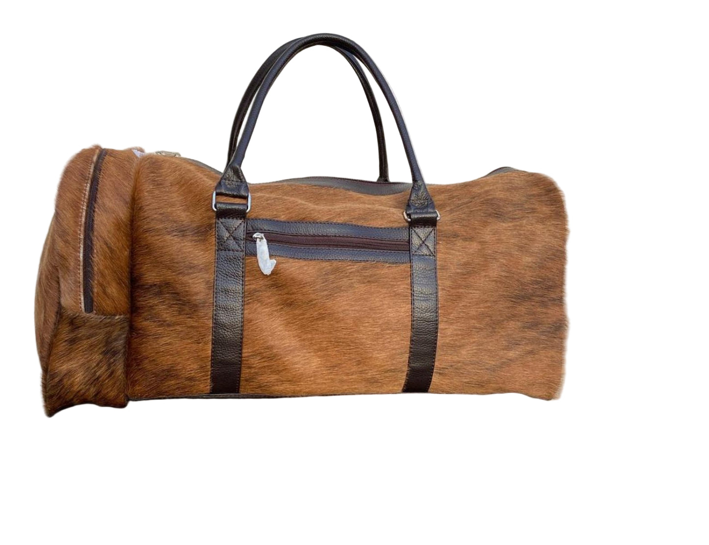 Brown duffel bag with black straps on a tiled floor