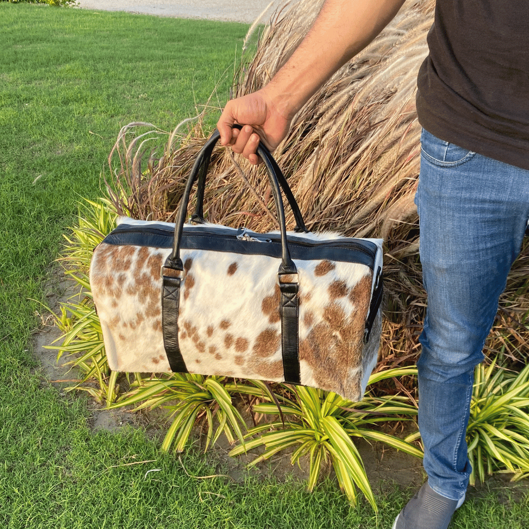 Luxury Brown & White Cowhide Duffel – Premium Travel Companion