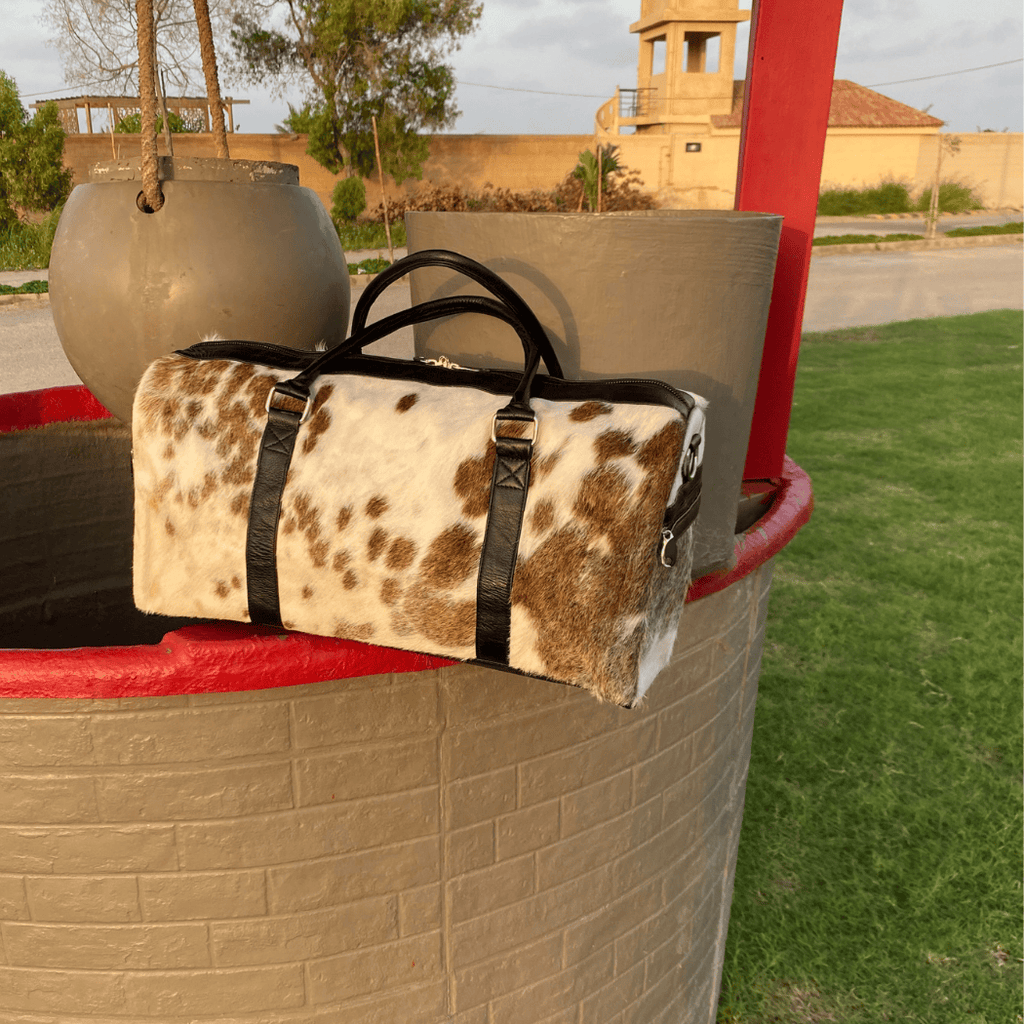 Luxury Brown & White Cowhide Duffel – Premium Travel Companion