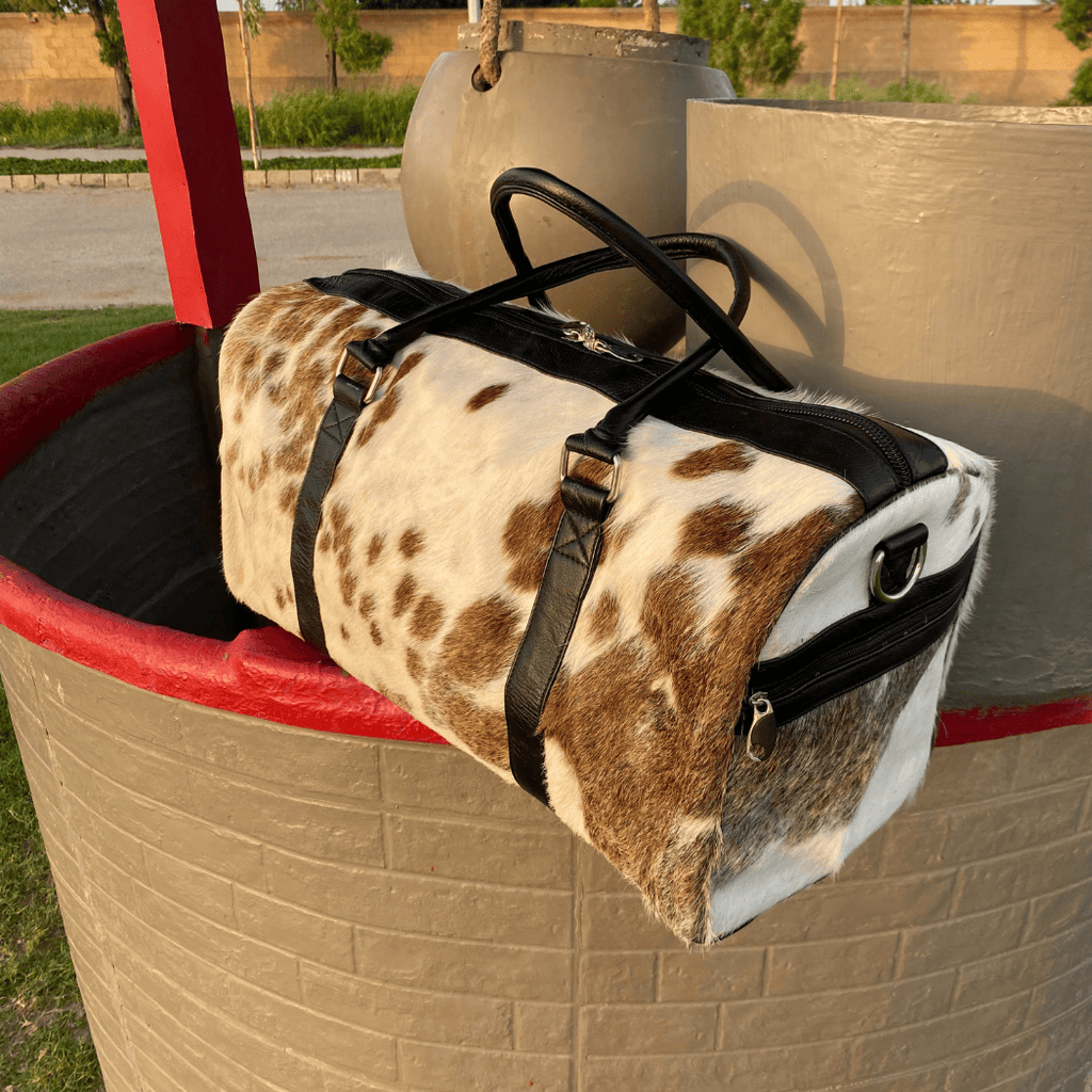 Luxury Brown & White Cowhide Duffel – Premium Travel Companion