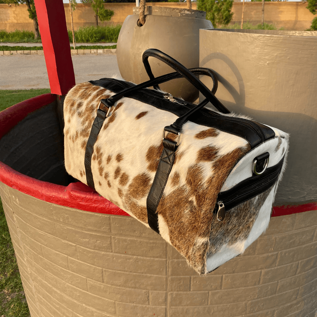 Luxury Brown & White Cowhide Duffel – Premium Travel Companion