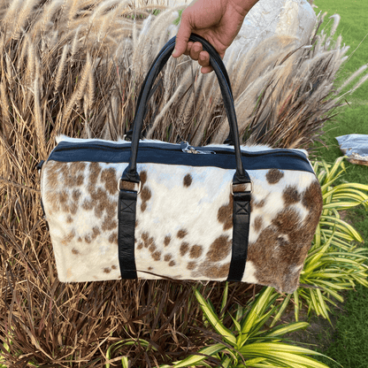 Luxury Brown & White Cowhide Duffel – Premium Travel Companion
