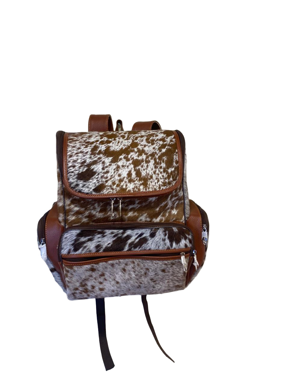 Backpack with cow print pattern on a textured surface