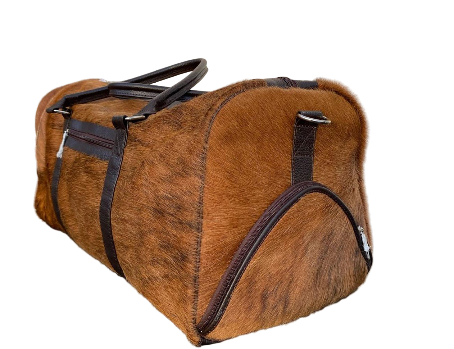 Brown leather duffel bag with black zippers on a tiled floor.